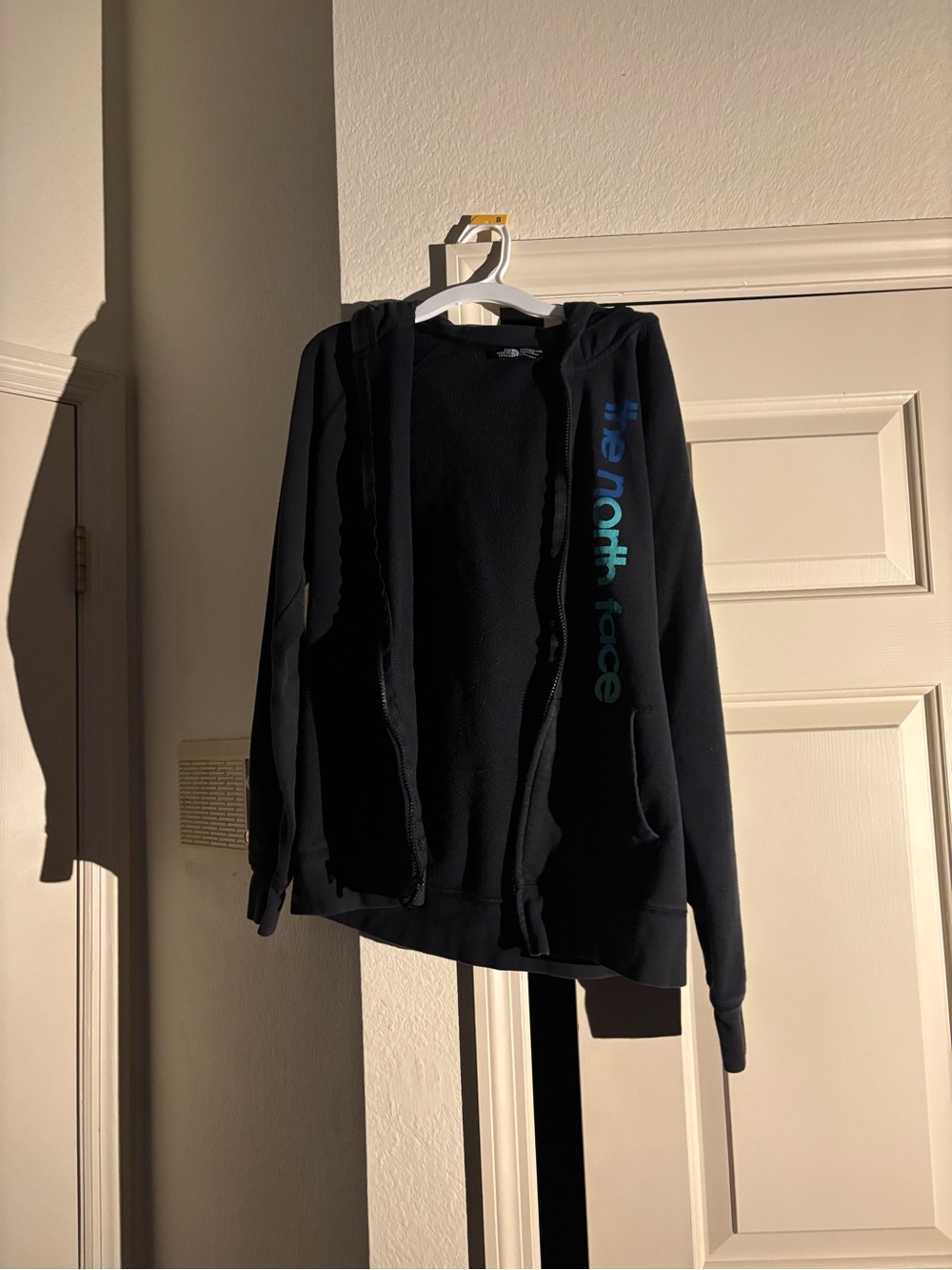 The North Face Black Hoodie with Blue-Green Logo